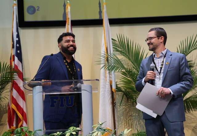 Deputy Director David Oliver (right) and Immigrant Youth Caseworker Saul Aleman (left) present to the FIU's Model UN. 